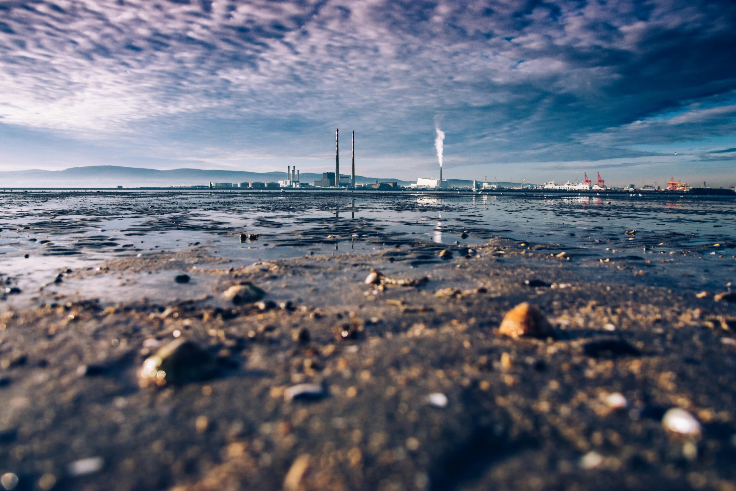 sea and smoke stacks